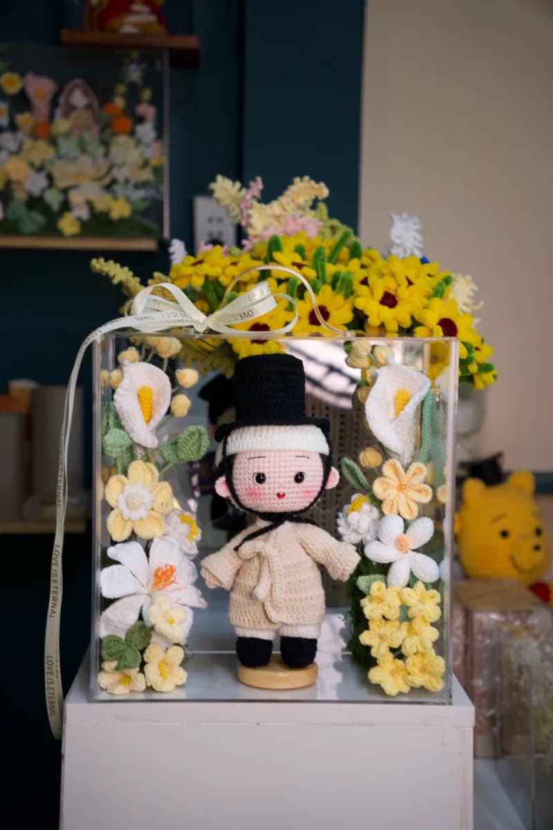Artisan handmade crochet doll dressed in delicate hand-stitched clothing