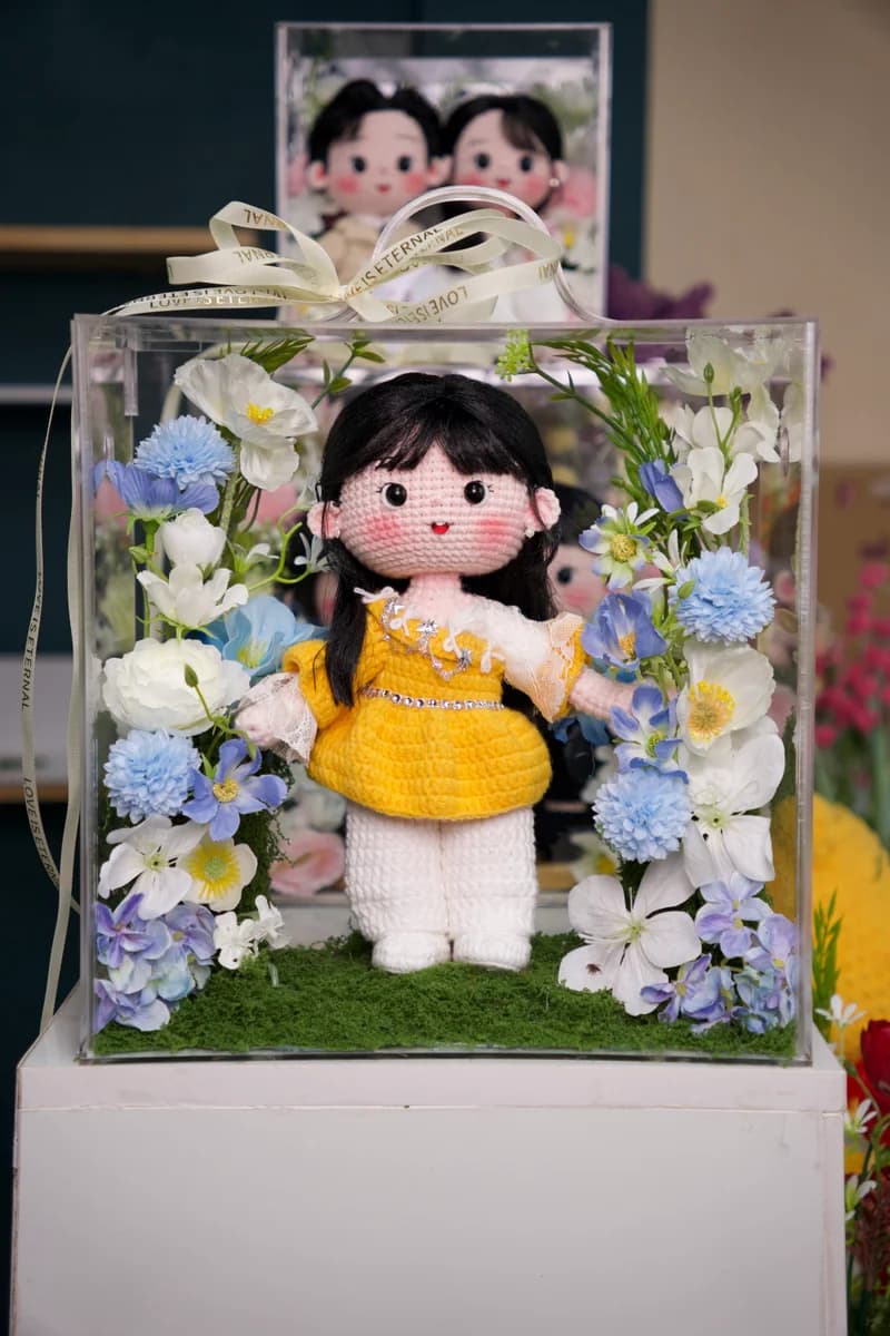 Bespoke handmade crochet character doll standing with accessories